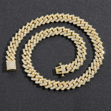 A gold-tone curb chain necklace laid in a loop on a white background.