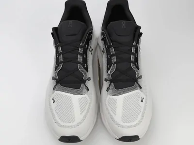 Pair of white and black running trainers seen from above
